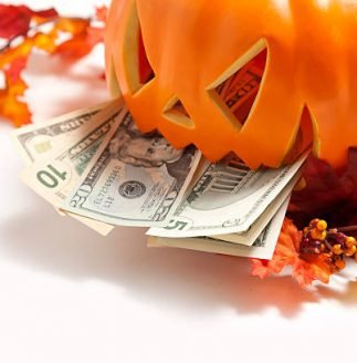 Studio shot of pumpkin and money